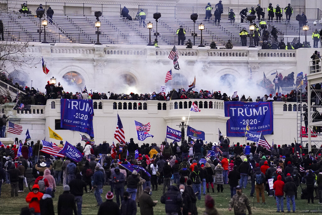 Violent insurrectionists loyal to President Donald Trump, storm the Capitol, Jan. 6, 2021, in Washington. (John Minchillo/Associated Press)