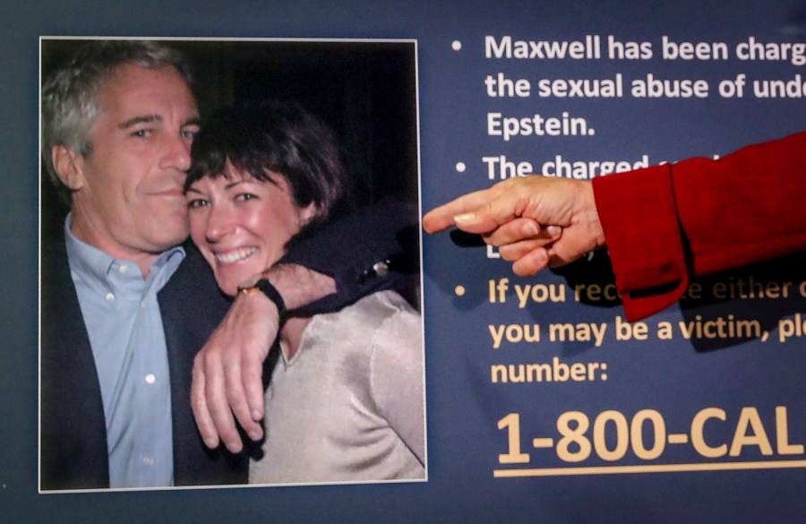 Audrey Strauss, acting U.S. attorney for the Southern District of New York, points to a photo of Jeffrey Epstein and Ghislaine Maxwell, during a news conference in New York on July 2, 2020. (John Minchillo/Associated Press)