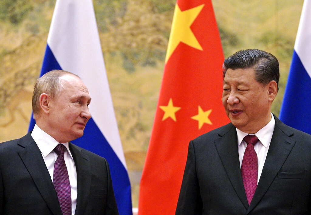 Chinese President Xi Jinping, right, and Russian President Vladimir Putin looks towards each other during their meeting in Beijing, China, on Feb. 4, 2022. (Alexei Druzhinin, Sputnik, Kremlin Pool Photo via AP, File)