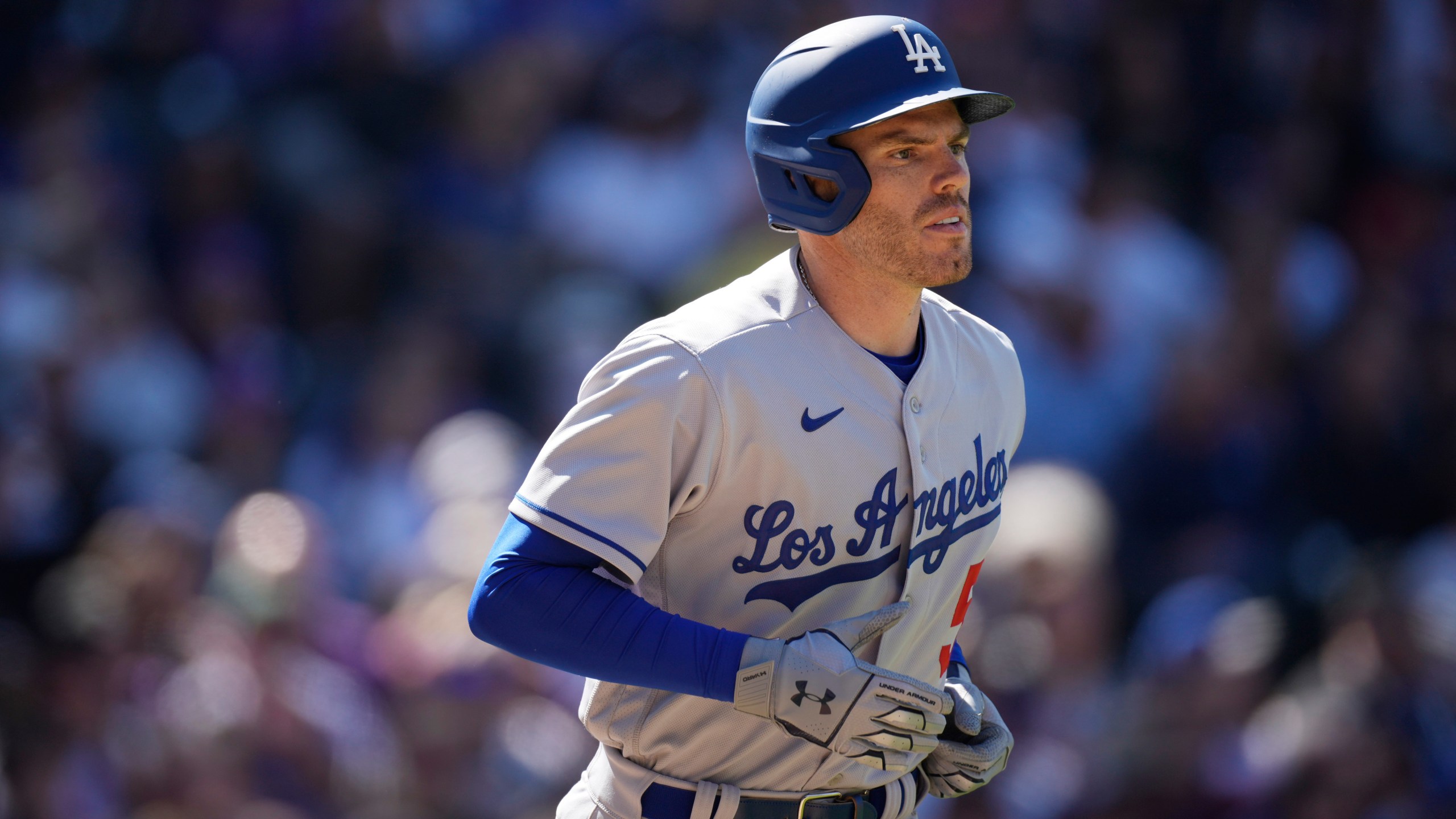 Los Angeles Dodgers' Freddie Freeman heads to first base after getting hit in the back by a pitch from Colorado Rockies starting pitcher Kyle Freeland in the third inning of a baseball game in Denver on April 8, 2022. (David Zalubowski/Associated Press)