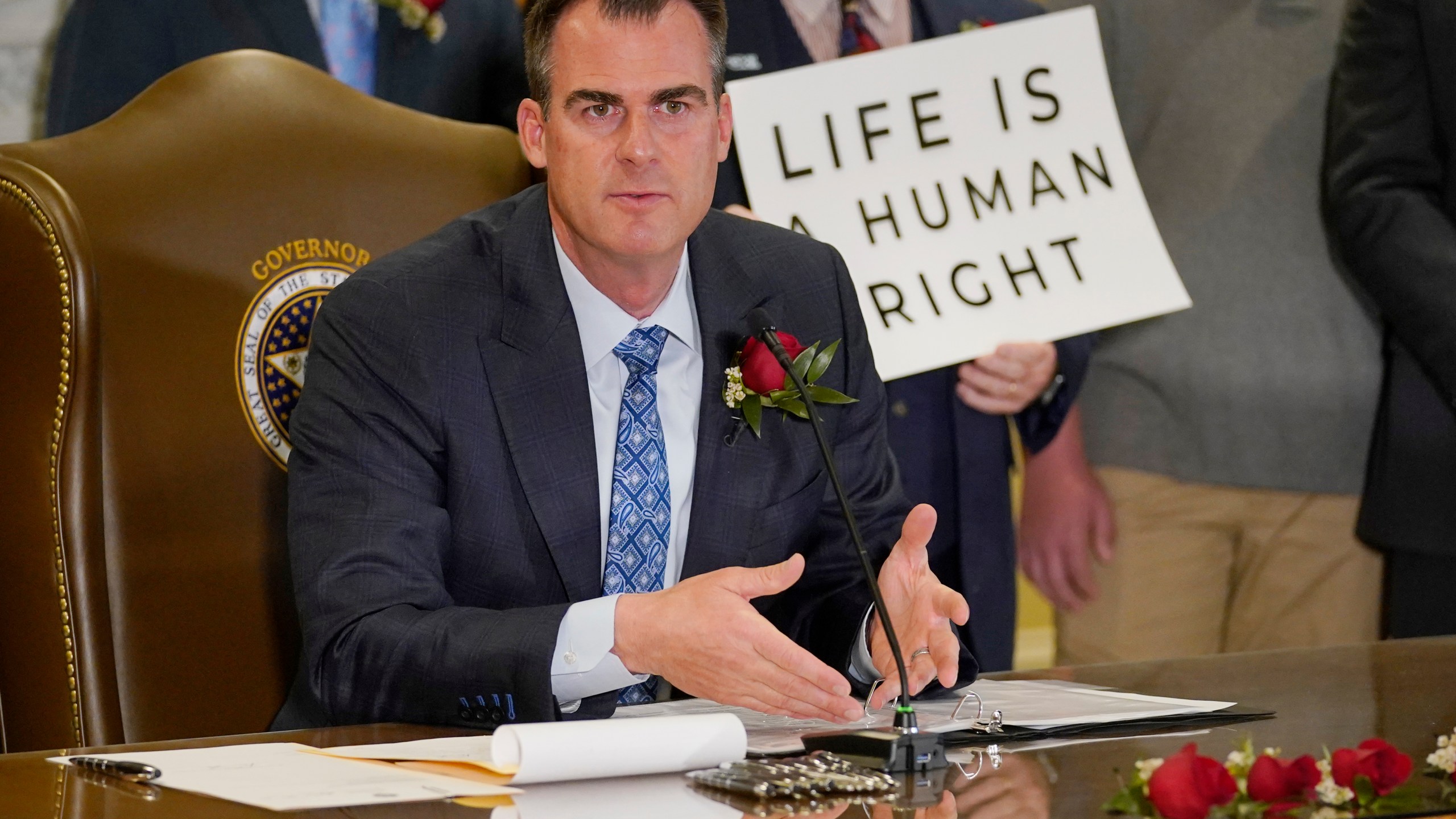 Oklahoma Gov. Kevin Stitt speaks after signing into law a bill making it a felony to perform an abortion, punishable by up to 10 years in prison on April 12, 2022, in Oklahoma City. (Sue Ogrocki/Associated Press)