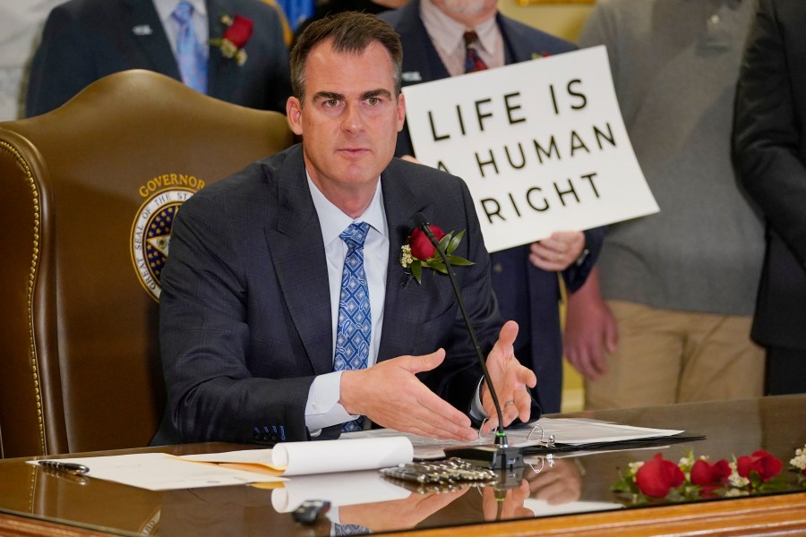 Oklahoma Gov. Kevin Stitt speaks after signing into law a bill making it a felony to perform an abortion, punishable by up to 10 years in prison on April 12, 2022, in Oklahoma City. (Sue Ogrocki/Associated Press)