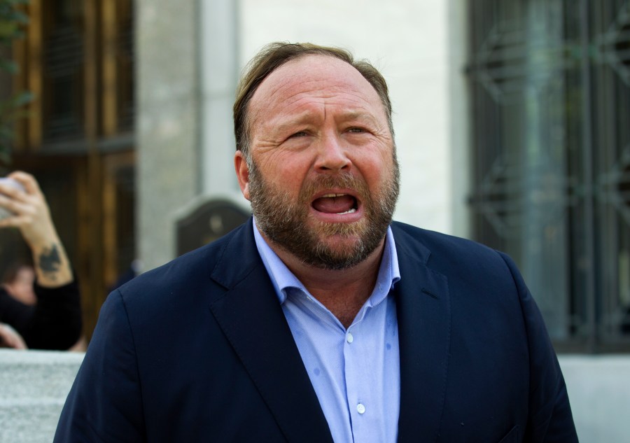 Alex Jones speaks to reporters in Washington on Sept. 5, 2018. Infowars filed for Chapter 11 bankruptcy protection on April 17, 2022, in Texas as its founder and conspiracy theorist Alex Jones faces defamation lawsuits over his comments that the Sandy Hook Elementary School shooting was a hoax. (Jose Luis Magana/Associated Press)