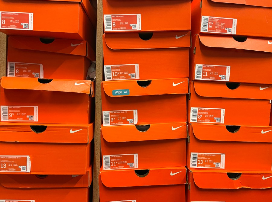 This file photo shows stacks of Nike shoe boxes at a shoe store in California. (Justin Sullivan/Getty Images)