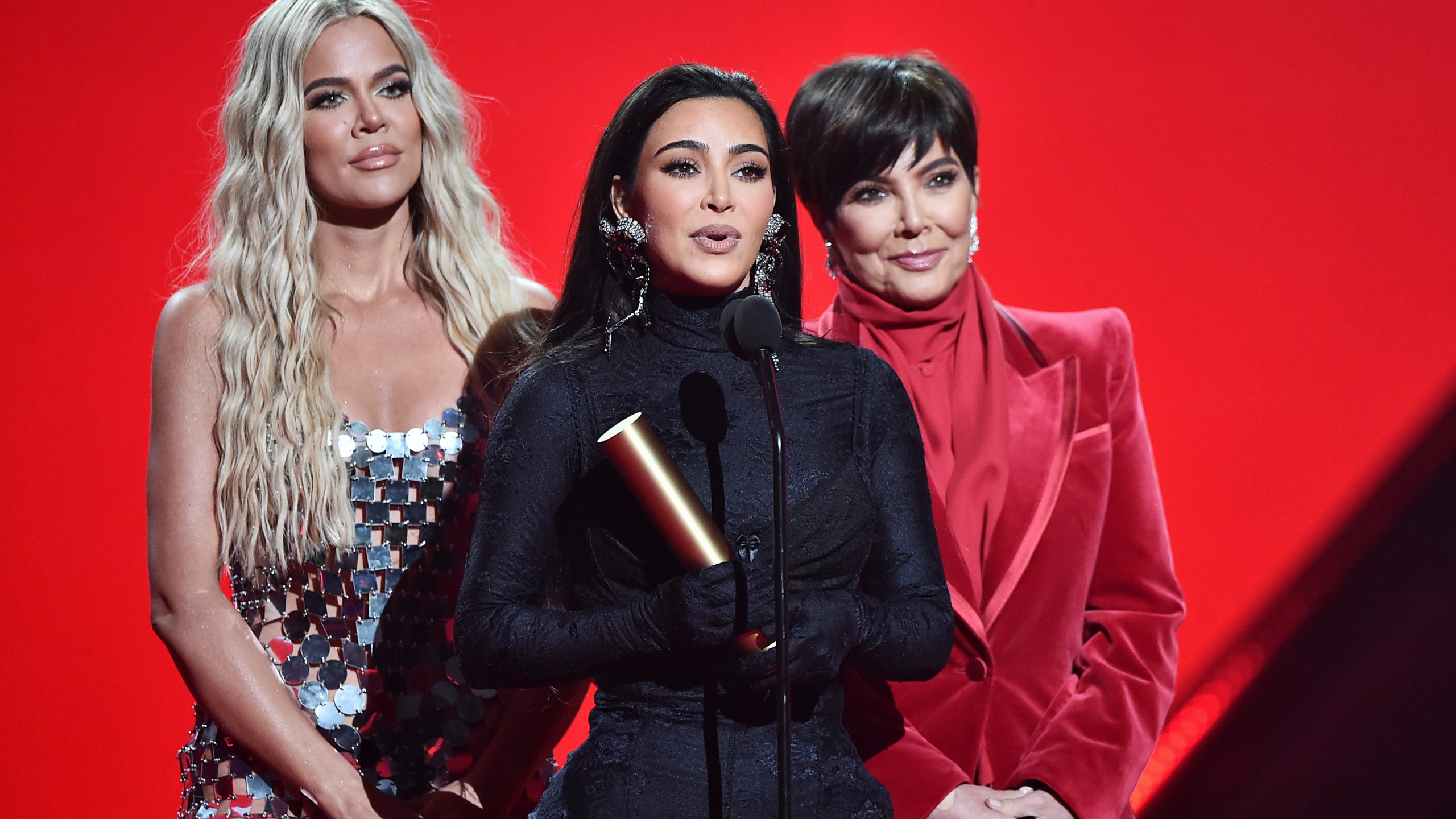 Khloé Kardashian, Kim Kardashian and Kris Jenner accept The Reality Show of 2021 award for ‘Keeping Up With the Kardashians' on stage during the 2021 People's Choice Awards held at Barker Hangar on Dec. 7, 2021 in Santa Monica. (Alberto Rodriguez/E! Entertainment/NBCUniversal/NBCU Photo Bank via Getty Images)