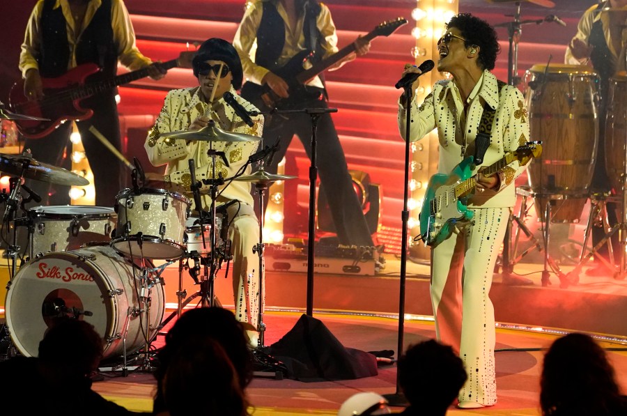 Anderson .Paak, left, and Bruno Mars of Silk Sonic perform "777" at the 64th Annual Grammy Awards on Sunday, April 3, 2022, in Las Vegas. (AP Photo/Chris Pizzello)