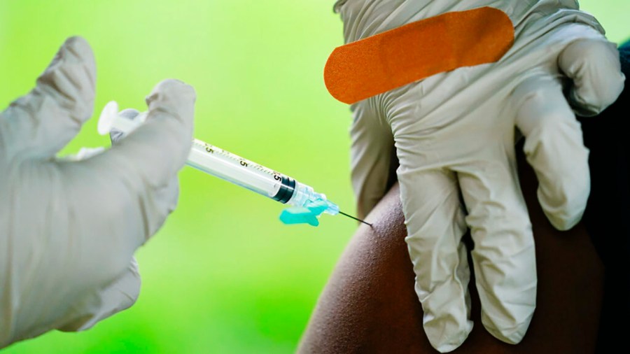 In this Sept. 14, 2021, file photo, a health worker administers a dose of a Pfizer COVID-19 vaccine. (AP Photo/Matt Rourke, File)