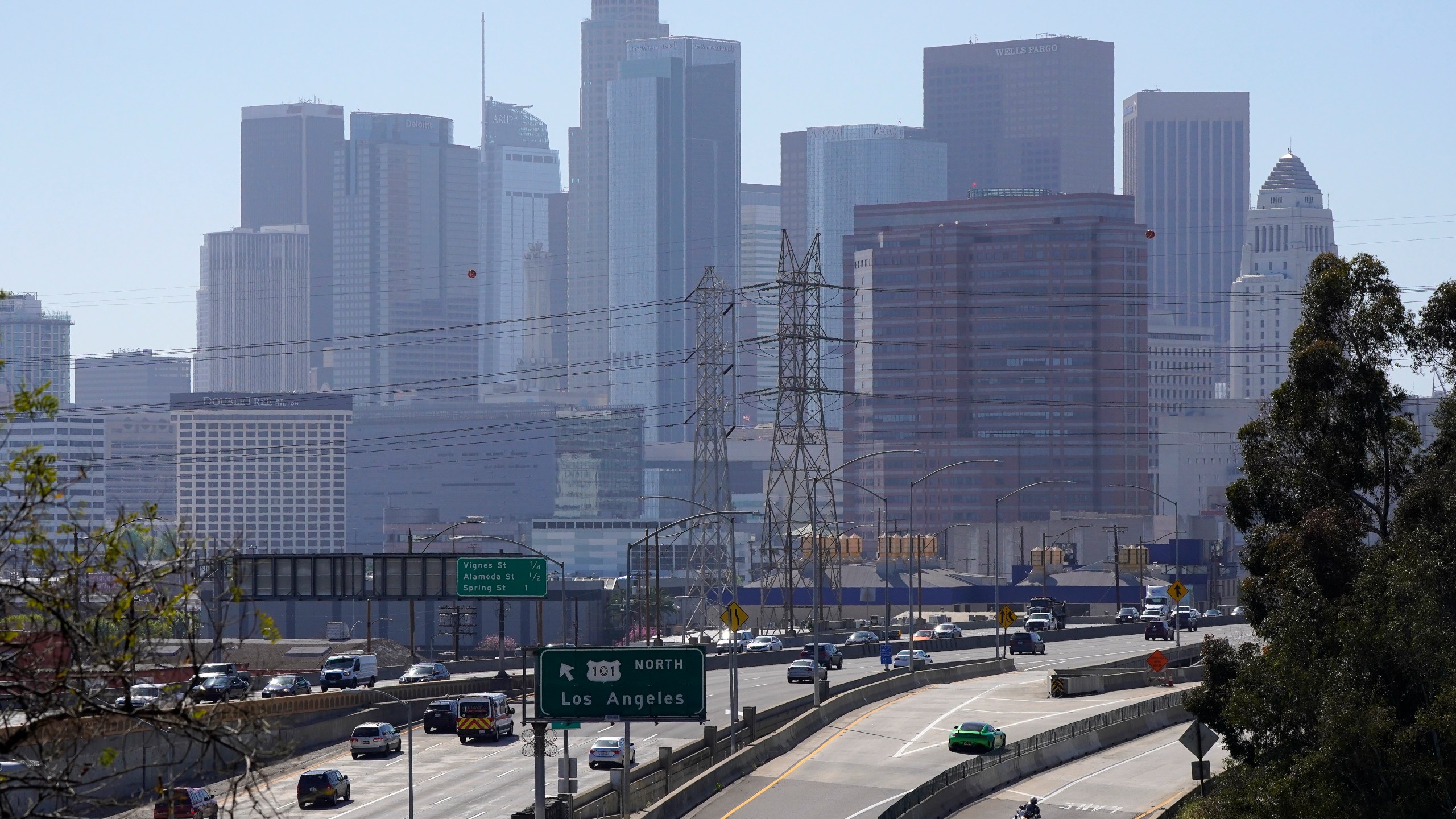 Traffic heads away from downtown along the 101 freeway, Thursday, April 16, 2020, in Los Angeles. (AP Photo/Mark J. Terrill)