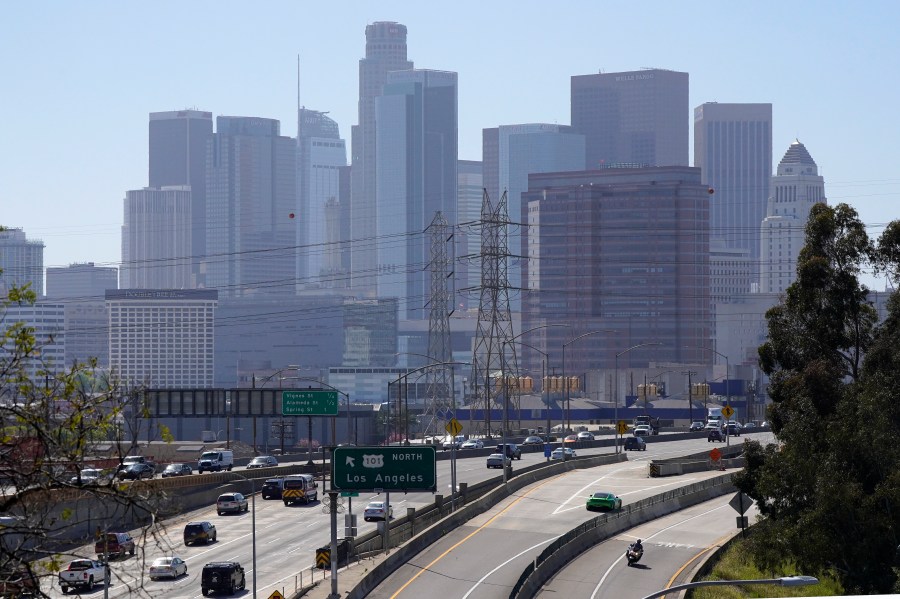 Traffic heads away from downtown along the 101 freeway, Thursday, April 16, 2020, in Los Angeles. (AP Photo/Mark J. Terrill)