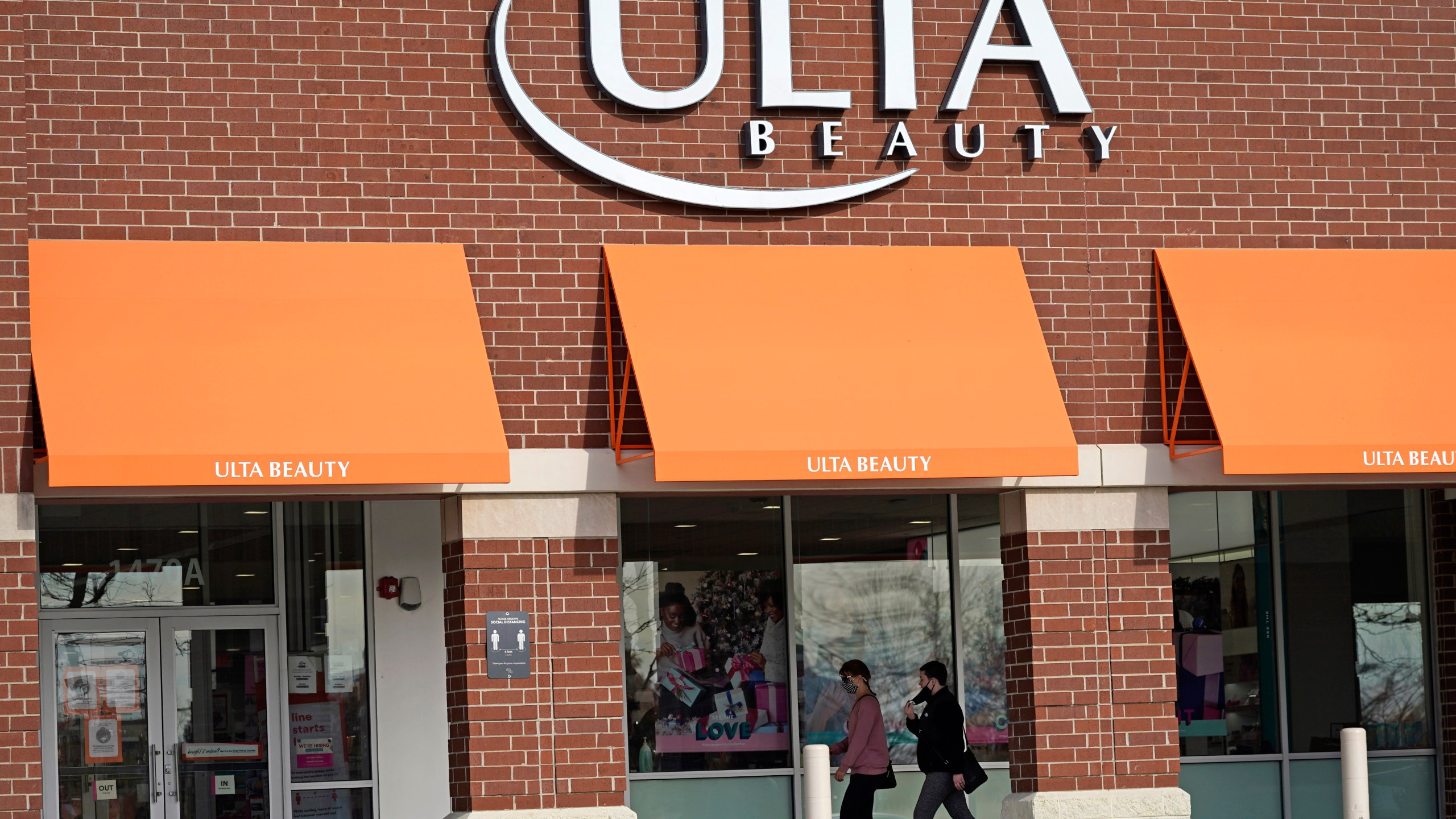 In this Nov. 5, 2020 file photo, women walk to an Ulta Beauty store in Schaumburg, Ill. (Nam Y. Huh/Associated Press)