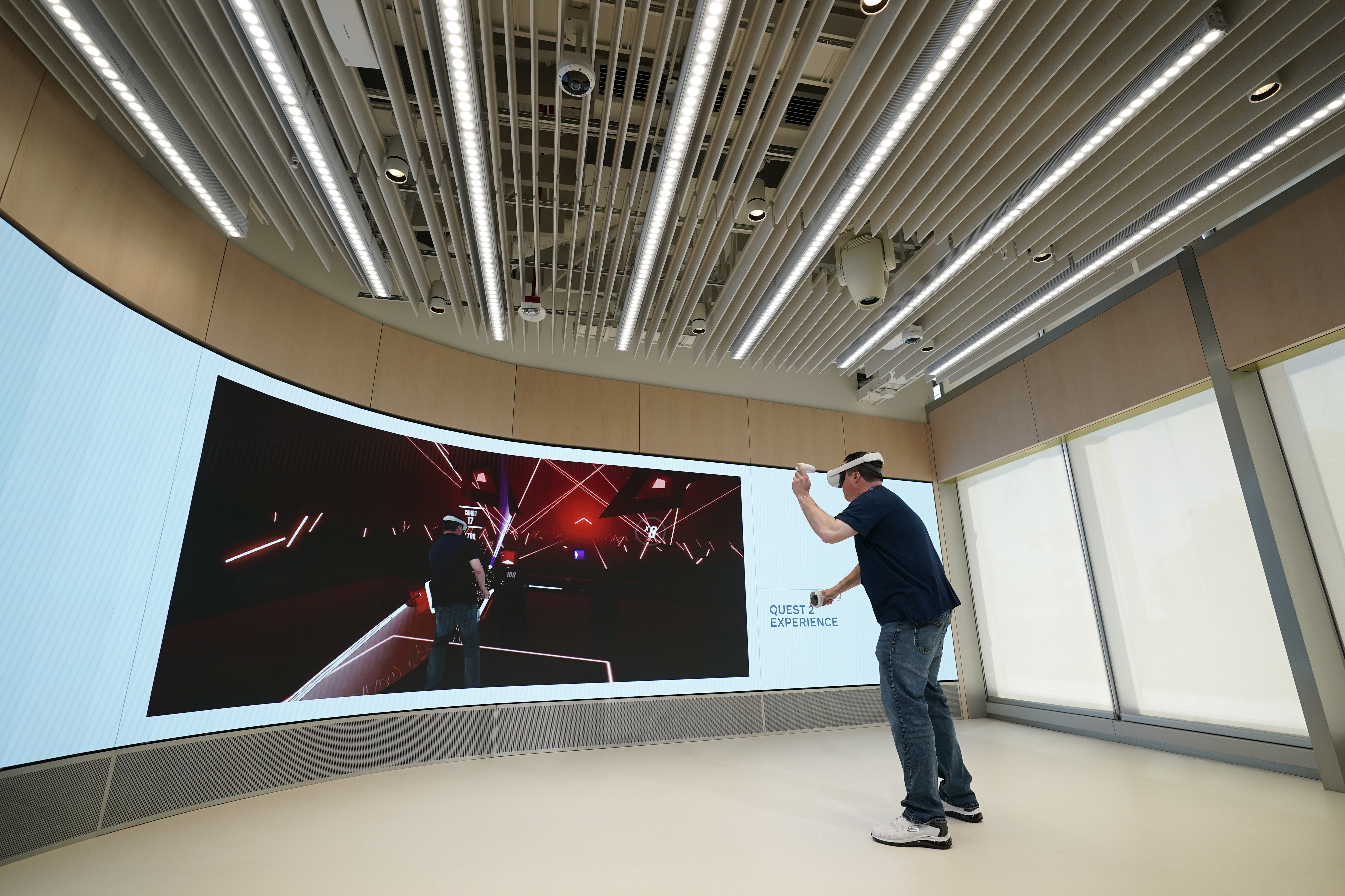 A man experiences the Quest 2 virtual headset during a preview of the Meta Store in Burlingame, Calif., on May 4, 2022. (AP Photo/Eric Risberg)