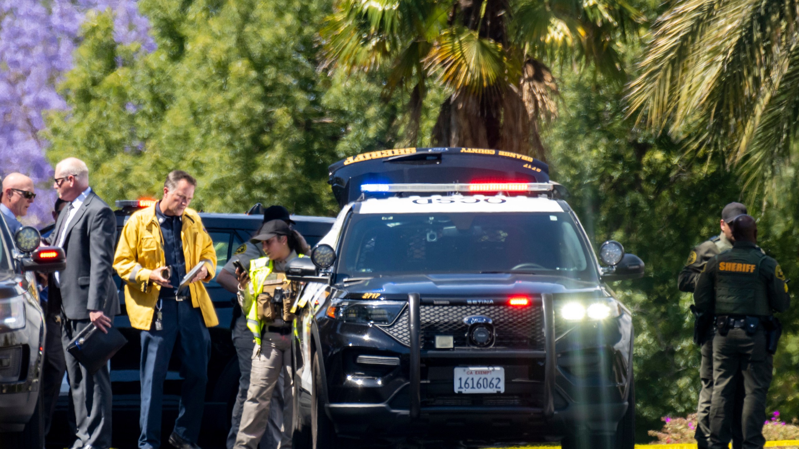 Investigators gather outside the Geneva Presbyterian Church in Laguna Woods, Calif., on Sunday, May 15, 2022 after a fatal shooting. (Leonard Ortiz/The Orange County Register via AP)