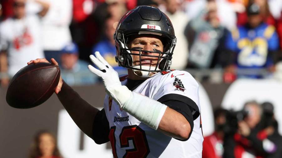 Tampa Bay Buccaneers quarterback Tom Brady (12) throws a pass against the Los Angeles Rams during the first half of an NFL divisional round playoff football game Jan. 23, 2022, in Tampa, Fla. (AP Photo/Mark LoMoglio, File)