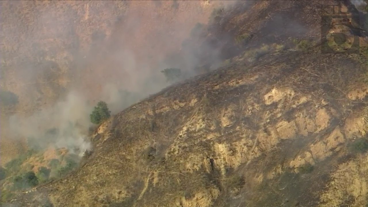 A fire burned in Lopez Canyon on May 14, 2022. (KTLA)