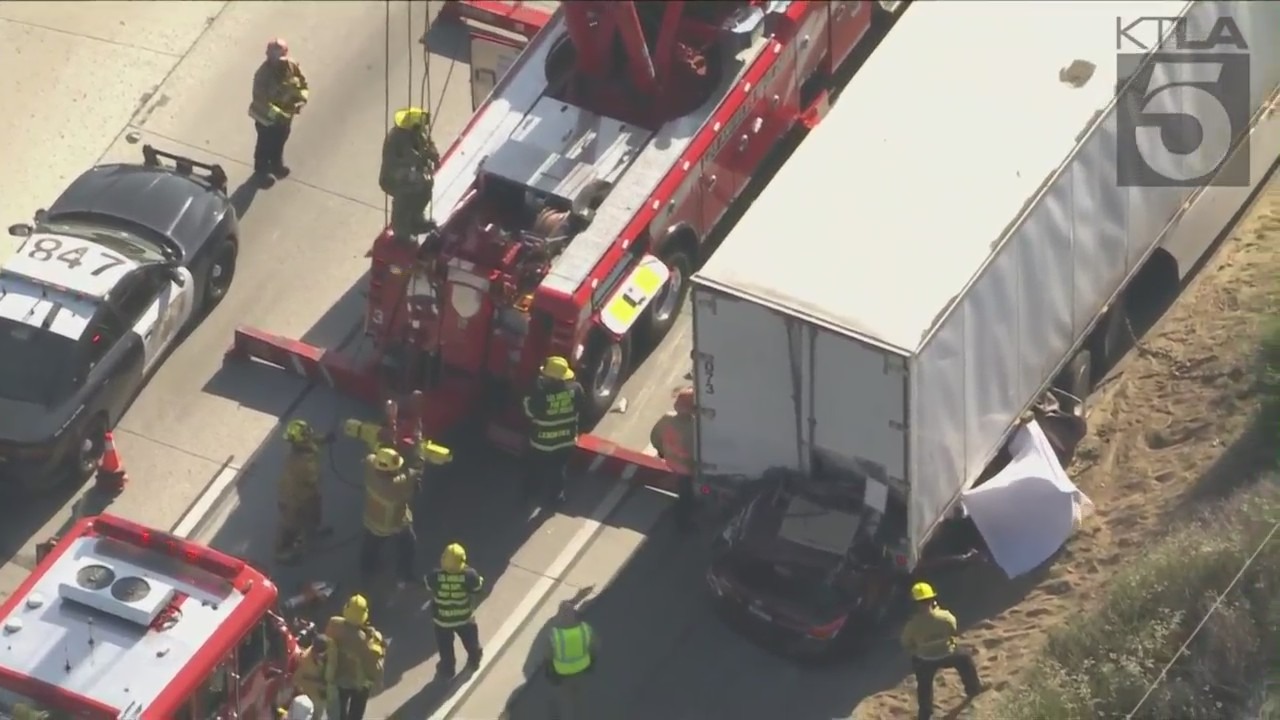 Two people died after a car slammed into the back of a big rig in Shadow Hills on May 16, 2022. (KTLA)