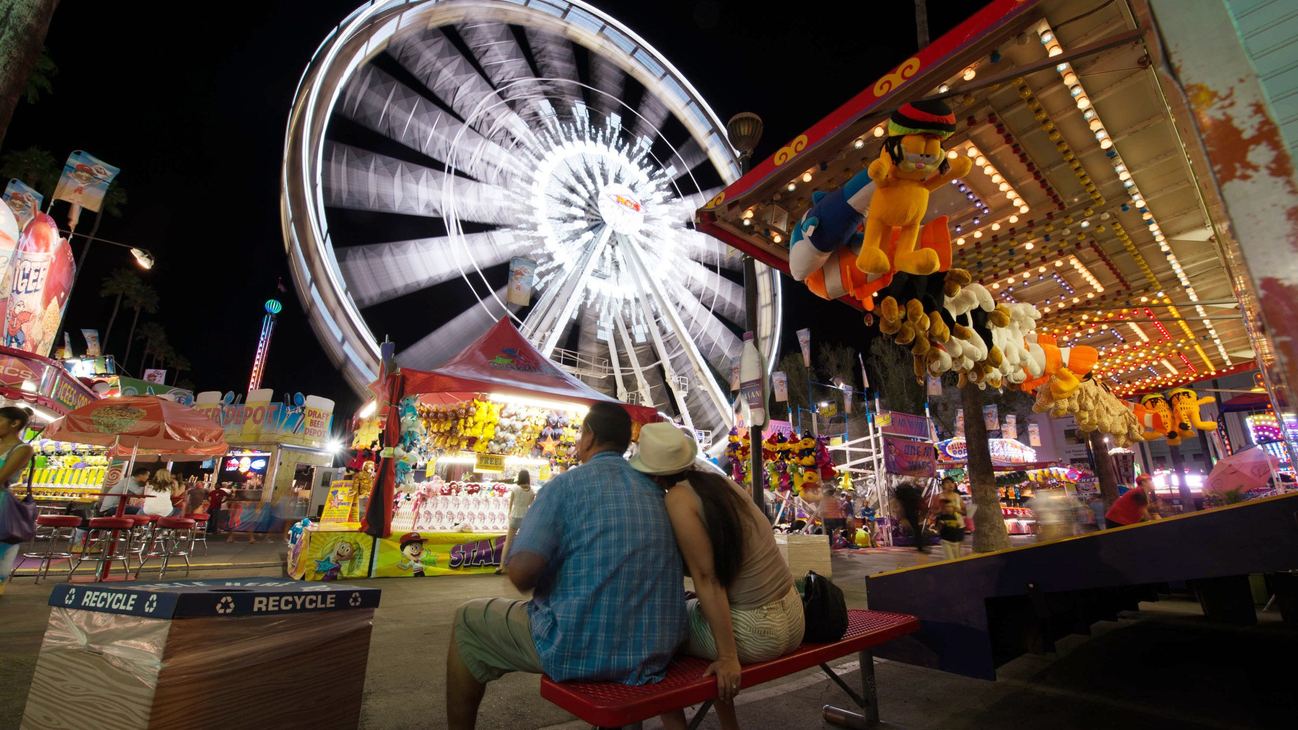 Visitors attend the Los Angeles County Fair 2013 in Pomona, California. (JOE KLAMAR/AFP via Getty Images)