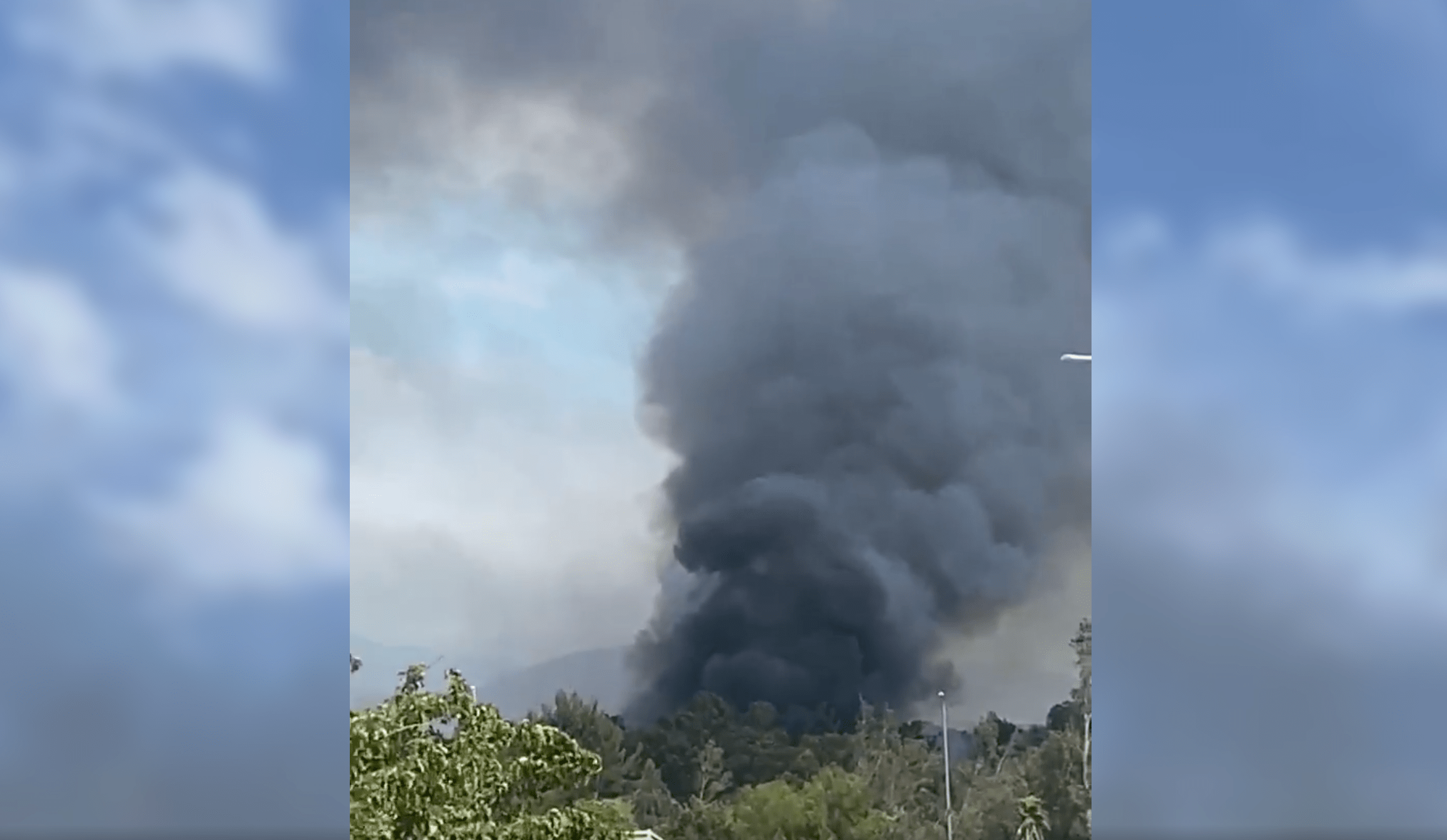 Smoke billows from a fire in Porter Ranch on Sunday, May 15, as shown in this photo posted to the Citizen app.