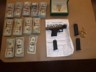 Items seized during an armed robbery investigation are shown in a photo released by the LAPD on May 20, 2022.