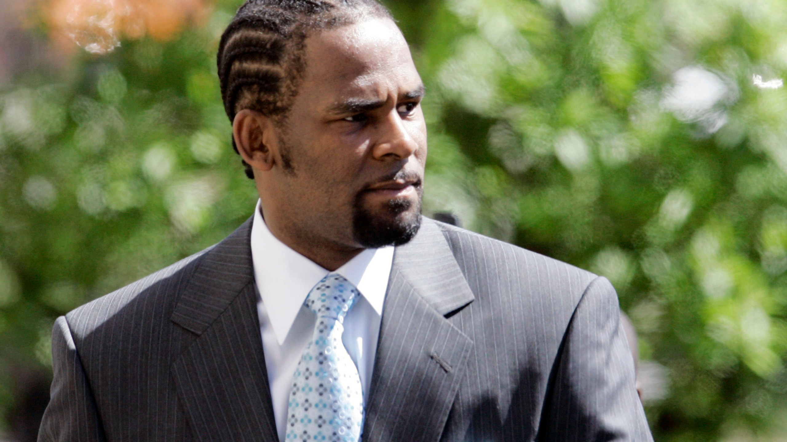 R. Kelly enters the Cook County Criminal Court Building, Wednesday, May 28, 2008, in Chicago. R. Kelly, the R&B superstar known for his anthem “I Believe I Can Fly,” deserves at least 25 years behind bars for sexually abusing women and girls, prosecutors said in a memo filed Wednesday, June 8, 2022 in advance of his sentencing later this month.(AP Photo/M. Spencer Green, File)