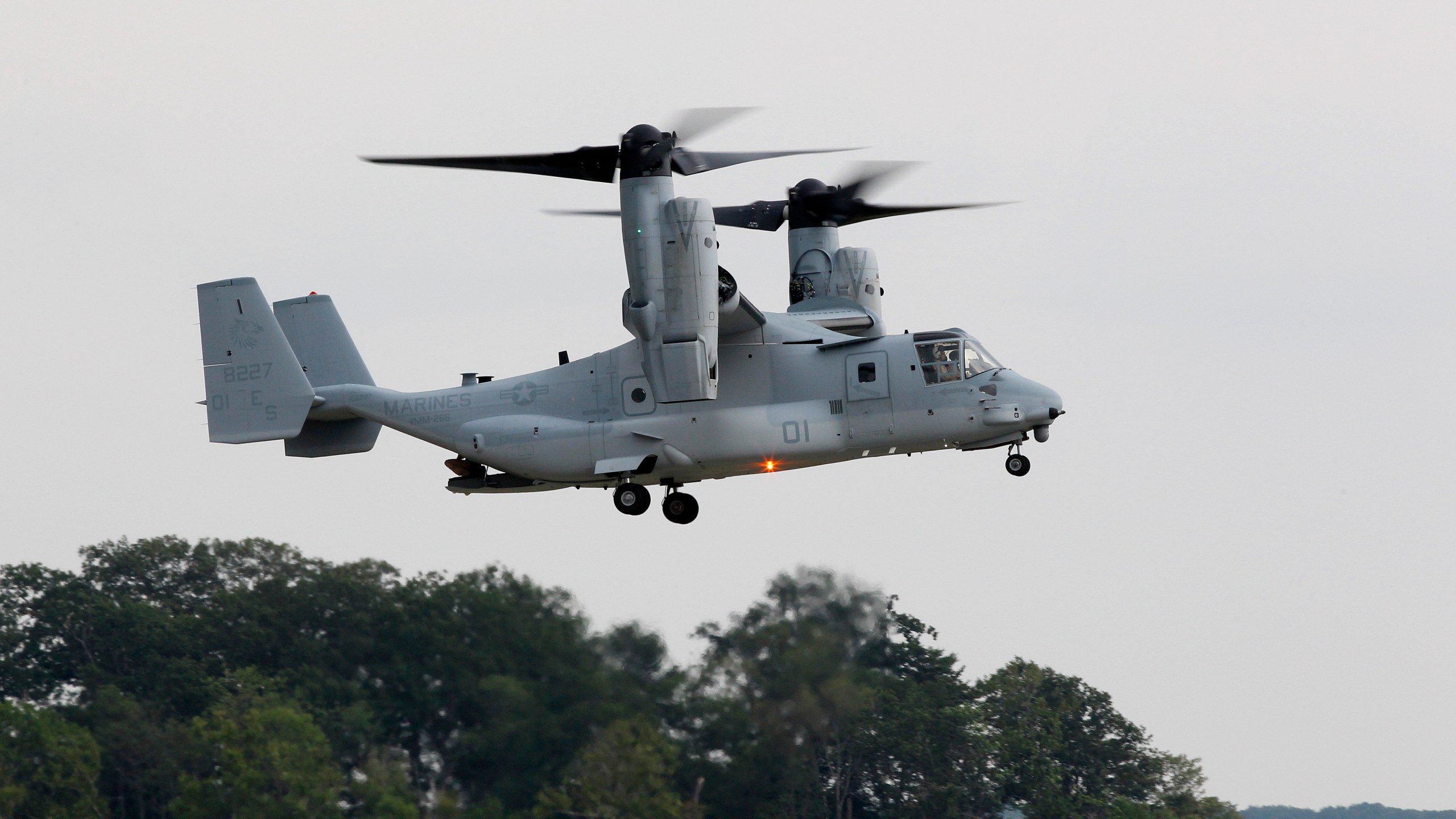 A MV-22B Osprey tiltrotor aircraft flies at Marine Corps Air Facility at Marine Corps Base in Quantico, Va., on on Aug. 3, 2012. Officials say a Marine Corps MV-22B Osprey carrying five Marines crashed in the Southern California desert, Wednesday afternoon, June 8, 2022, during training in a remote area near the community of Glamis in Imperial County. Military officials have yet to release official word on the fate of the five Marines. (AP Photo/Haraz N. Ghanbari, File)