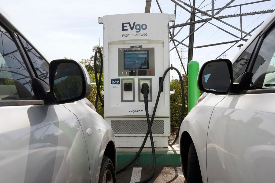 Electric cars are parked at a charging station in Sacramento, Calif., Wednesday, April 13, 2022. California air regulators will take public comment Thursday, June 23 2022, on a plan to slash fossil fuel use and reach carbon neutrality by 2045. (AP Photo/Rich Pedroncelli, File)