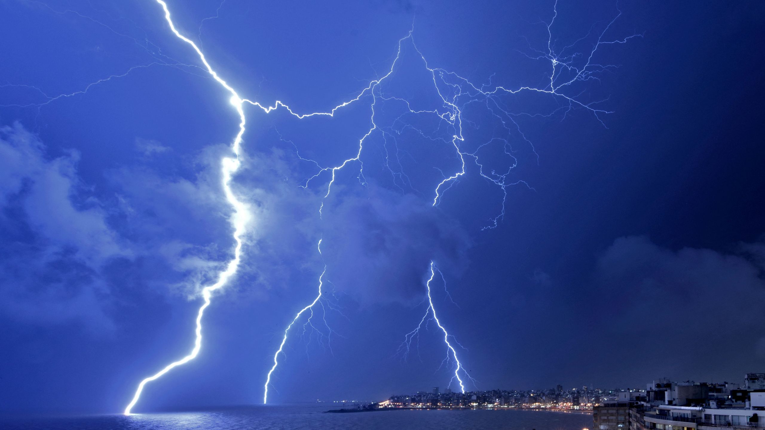 Lightning strikes during a thunderstorm in Montevideo on February 20, 2022. (Photo by Mariana SUAREZ / AFP)