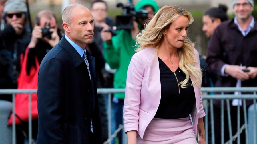 In this April 16, 2018 file photo, Stormy Daniels, right, and her attorney Michael Avenatti turn from the microphones after speaking as they leave federal court in New York. (AP Photo/Seth Wenig, File)