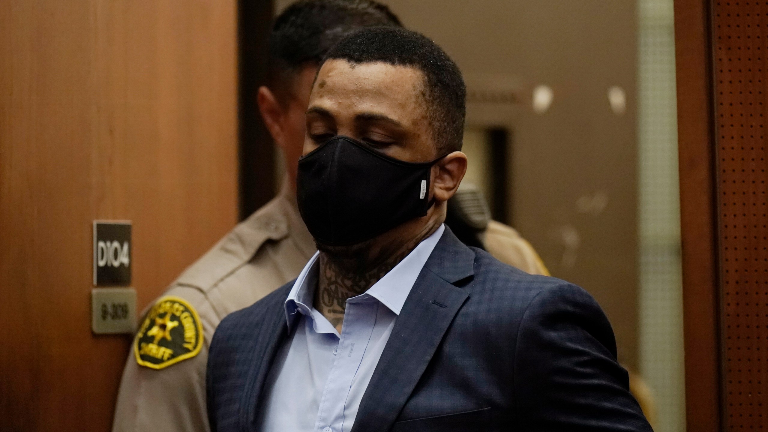 Eric Holder Jr., who is accused of killing rapper Nipsey Hussle, enters a courtroom to hear the verdicts in his murder trial at Los Angeles Superior Court on July 6, 2022. (Jae C. Hong, Pool)