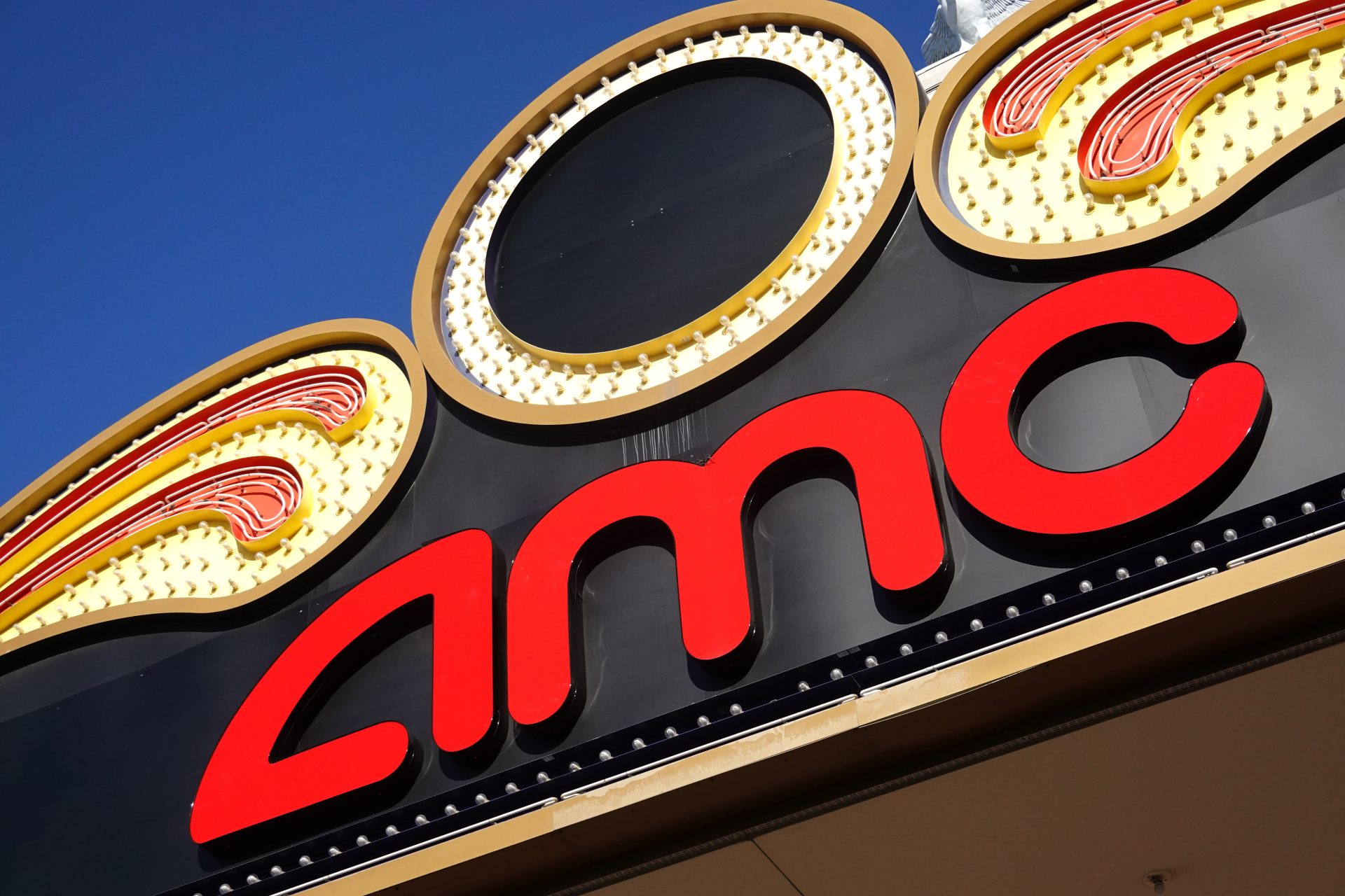 An AMC Theatres logo hangs above one of the company's movie theaters on Dec. 4, 2020 in Rosemont, Illinois. (Scott Olson/Getty Images)