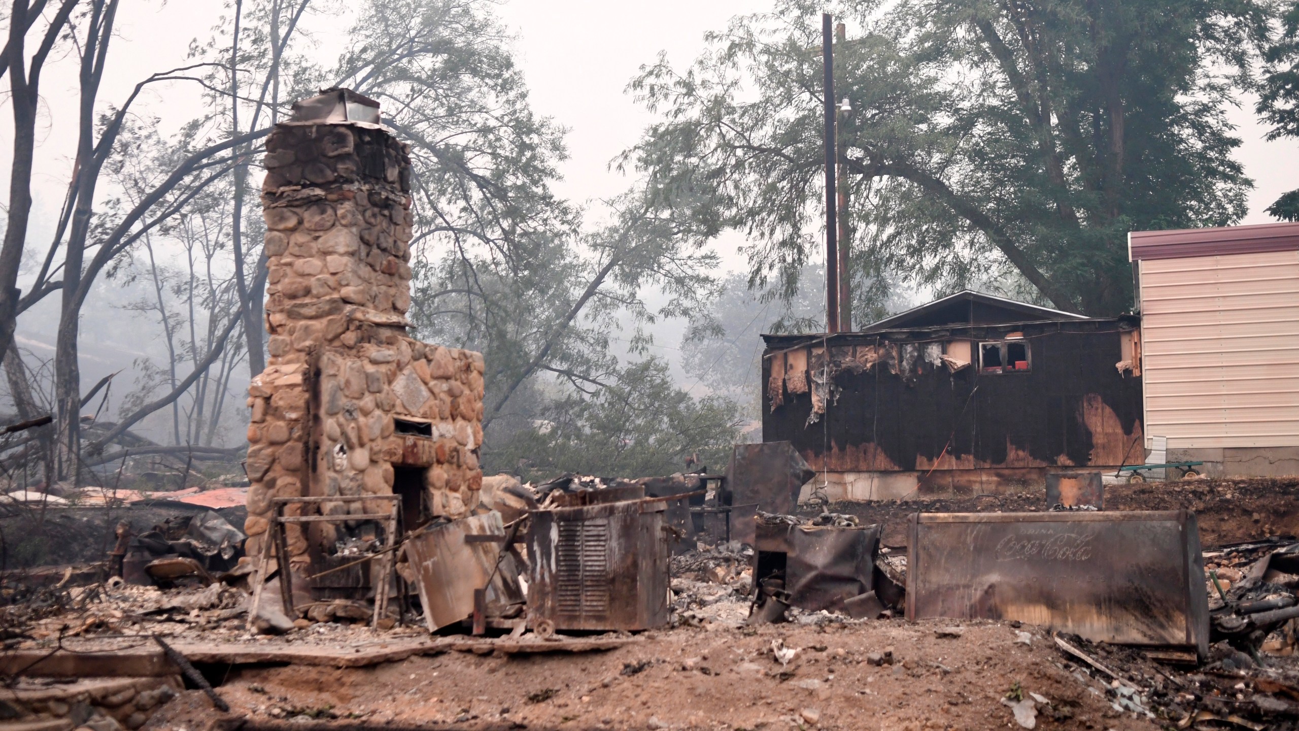 A structure in Klamath River, Calif., is seen destroyed by the McKinney Fire, Saturday, July 30, 2022. (Scott Stoddard/Grants Pass Daily Courier via AP)