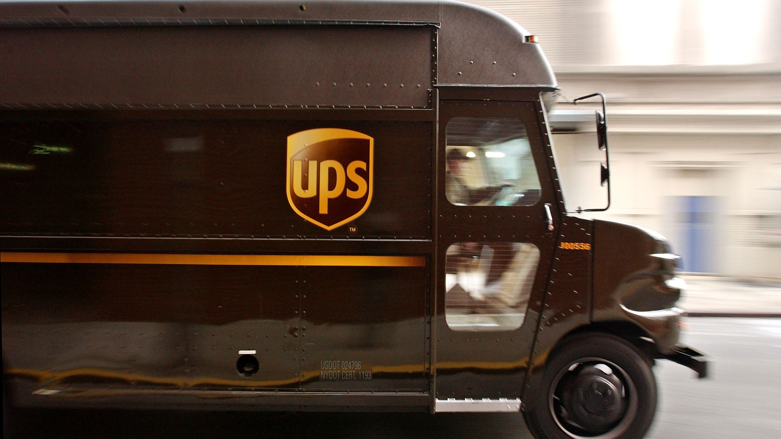 A delivery truck makes its way out of the 43rd Street United Parcel Service (UPS) depot Dec. 23, 2003, in New York City. (Stephen Chernin/Getty Images)