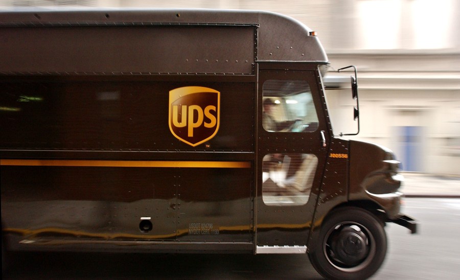 A delivery truck makes its way out of the 43rd Street United Parcel Service (UPS) depot Dec. 23, 2003, in New York City. (Stephen Chernin/Getty Images)