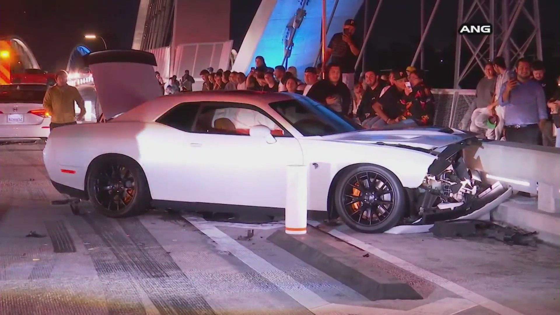 A crowd gathers after a crash on the 6th Street bridge on July 18, 2022. (ANG)