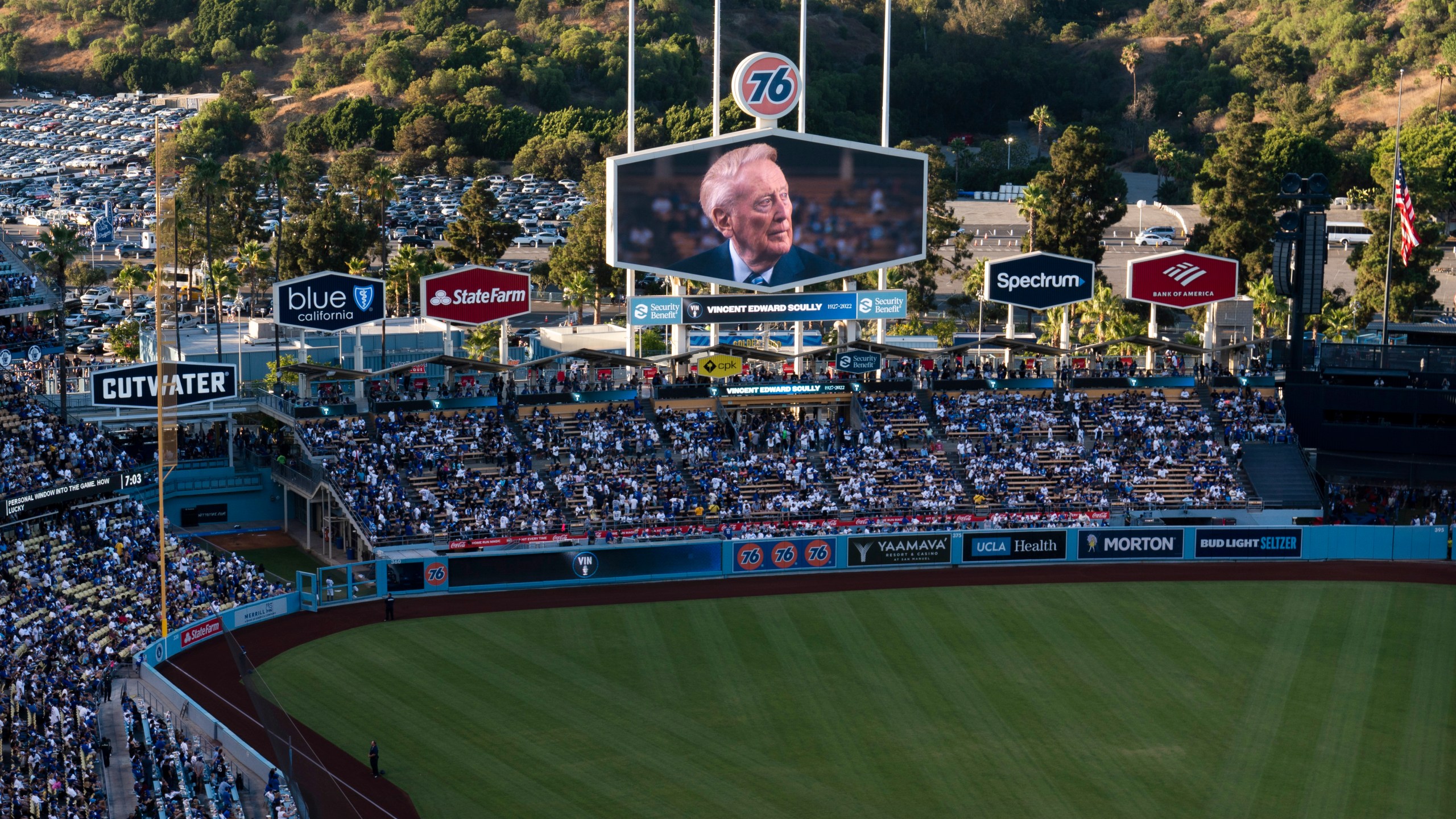 A screen at Dodger Stadium shows late broadcaster Vin Scully during a tribute to him before a baseball game between the Los Angeles Dodgers and the San Diego Padres on Friday, Aug. 5, 2022, in Los Angeles. (AP Photo/Jae C. Hong)