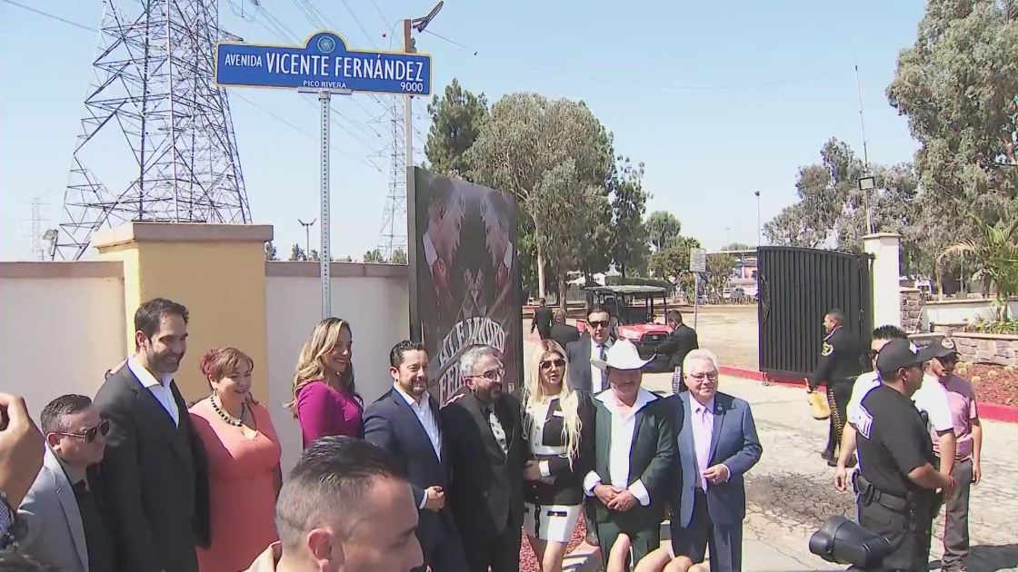 A new street sign donning the name of legendary Mexican artist Vicente Fernandez is unveiled on Aug. 26, 2022. (KTLA)