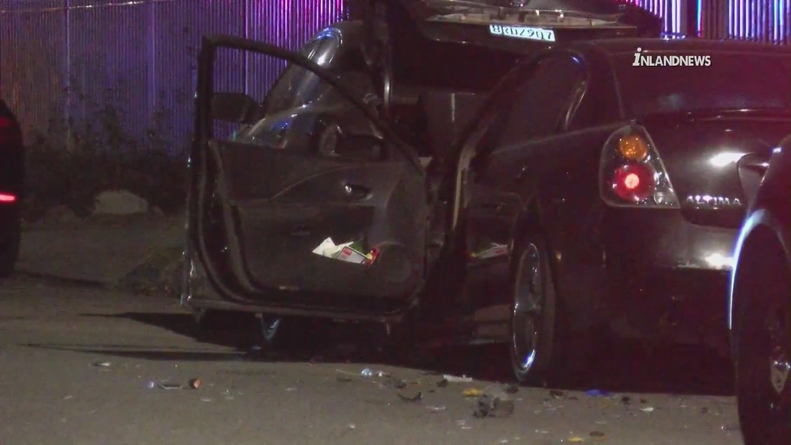 A shot-out vehicle is seen amid a homicide investigation in Colton on Aug. 25, 2022. (Inland Valley News)