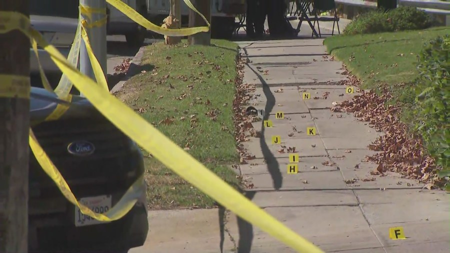 Crime tape and evidence markers sit at the site of a deadly stabbing in Canoga Park on Aug. 7, 2022 (KTLA)