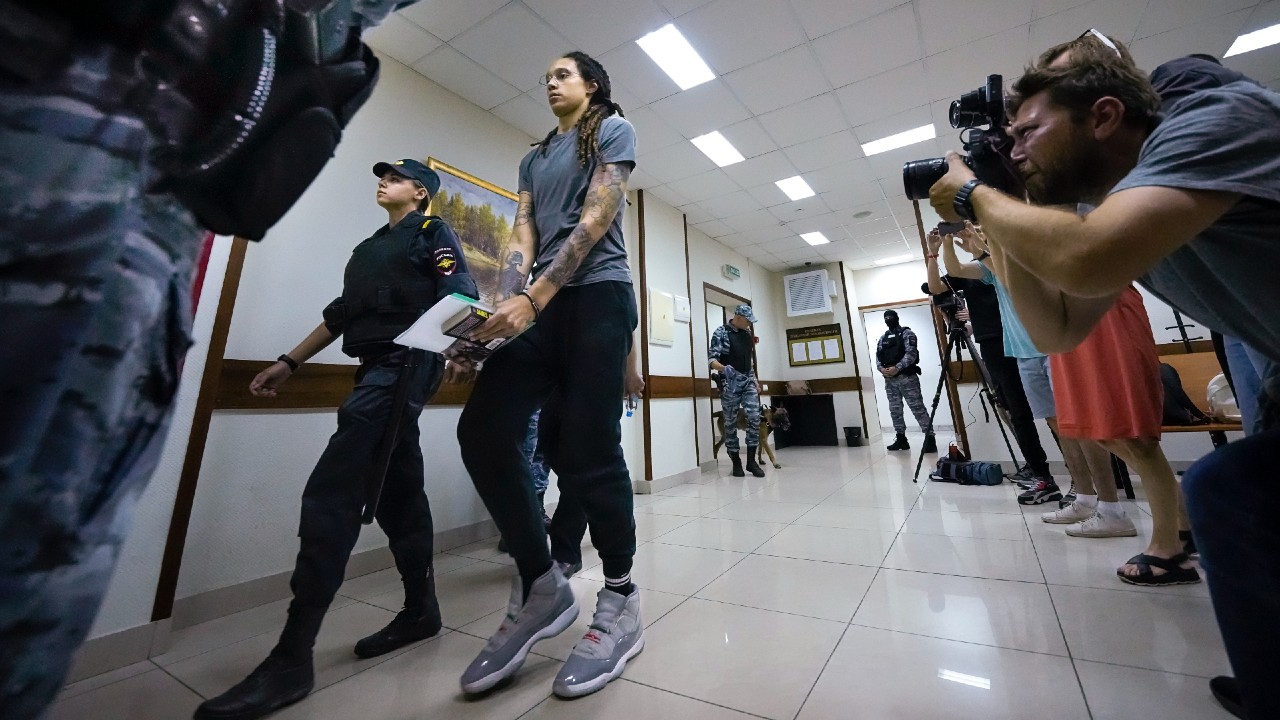 WNBA star and two-time Olympic gold medalist Brittney Griner is escorted from a court room ater a hearing, in Khimki just outside Moscow, Russia, Thursday, Aug. 4, 2022. (AP Photo/Alexander Zemlianichenko)