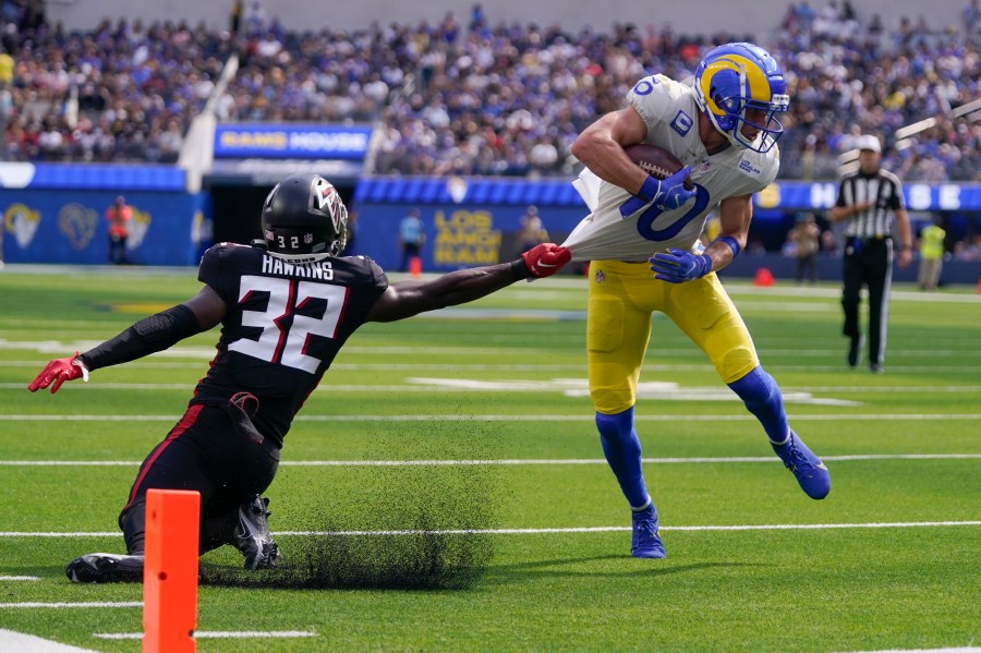 Los Angeles Rams wide receiver Cooper Kupp, right, gets away from Atlanta Falcons safety Jaylinn Hawkins as he scores a touchdown during the second half of an NFL football game Sunday, Sept. 18, 2022, in Inglewood, Calif. (AP Photo/Mark J. Terrill)