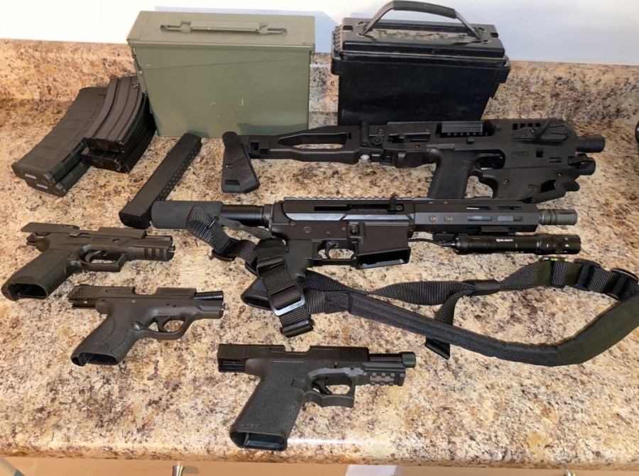 This photo provided by the Los Angeles Police Department shows some of the guns and components seized in a search warrant served on Sept. 8, 2022.