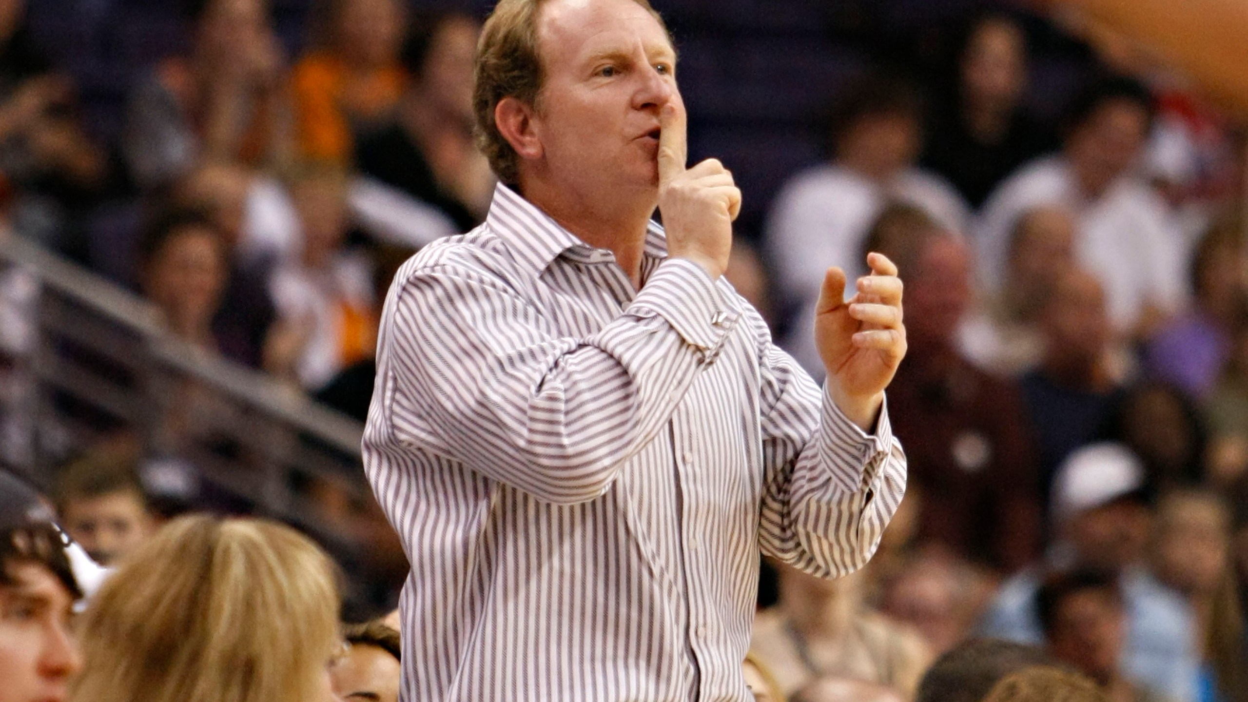 Phoenix Suns owner Robert Sarver gestures to Indiana Pacers' Danny Granger after Granger missed a shot during the second half of an NBA basketball game Saturday, March 6, 2010 in Phoenix. Robert Sarver says he has started the process of selling the Phoenix Suns and Phoenix Mercury, a move that comes only eight days after he was suspended by the NBA over workplace misconduct including racist speech and hostile behavior toward employees. Sarver made the announcement Wednesday, Sept. 21, 2022, saying selling “is the best course of action.” He has owned the teams since 2004. (AP Photo/Matt York, File)