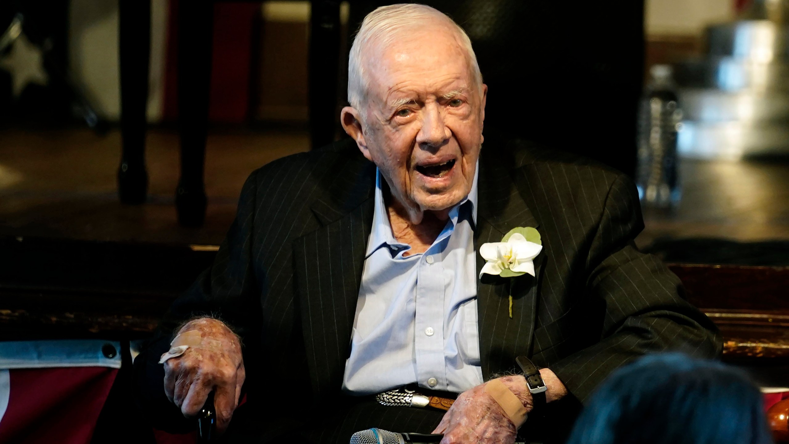 Former President Jimmy Carter reacts as his wife Rosalynn Carter speaks during a reception to celebrate their 75th wedding anniversary Saturday, July 10, 2021, in Plains, Ga.. (AP Photo/John Bazemore, Pool, File)