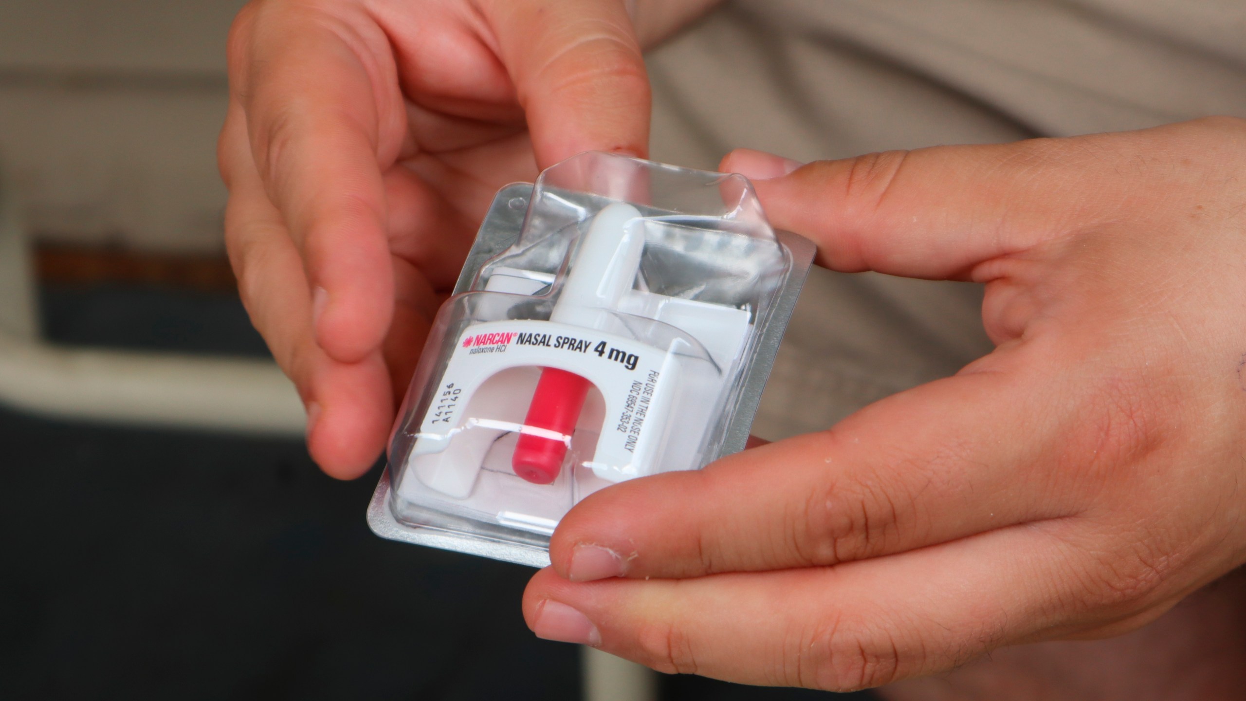 Joe Solomon, co-director of Charleston-based Solutions Oriented Addiction Response, holds a dose of the opioid overdose reversal drug Narcan at the Unitarian Universalist Congregation of Charleston in Charleston, W.Va., on Sept. 6, 2022. (Leah Willingham/Associated Press)