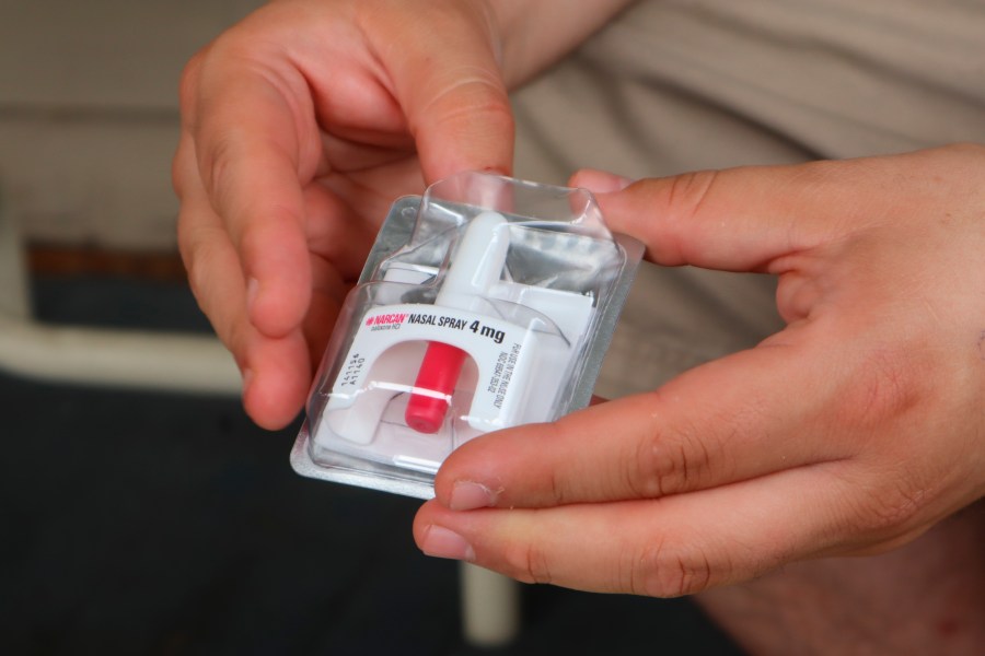 Joe Solomon, co-director of Charleston-based Solutions Oriented Addiction Response, holds a dose of the opioid overdose reversal drug Narcan at the Unitarian Universalist Congregation of Charleston in Charleston, W.Va., on Sept. 6, 2022. (Leah Willingham/Associated Press)