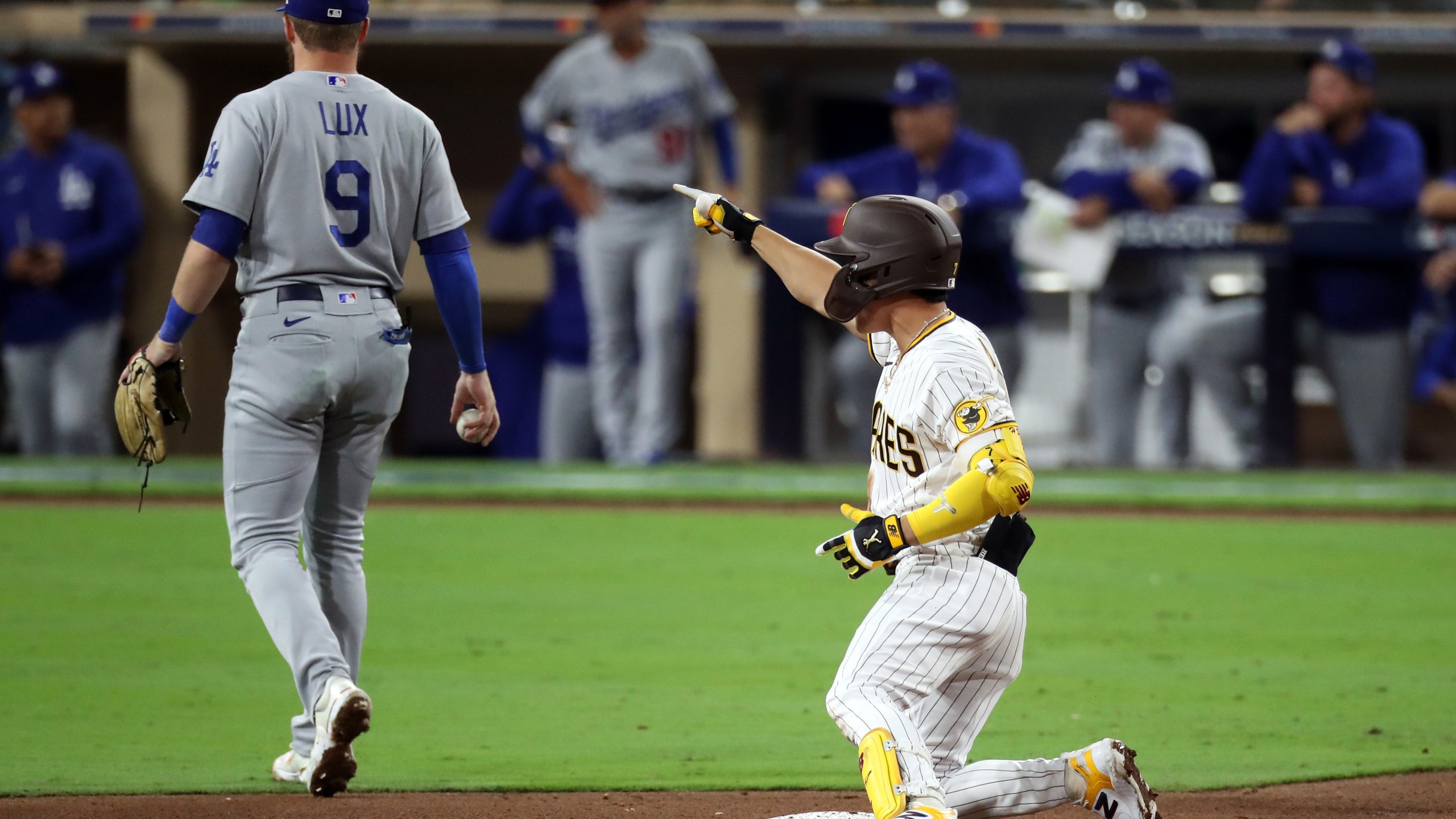 Ha-Seong Kim of the San Diego Padres celebrates after hitting a RBI double during the seventh inning against the Los Angeles Dodgers in Game 4 of the National League Division Series at Petco Park on Oct. 15, 2022, in San Diego. (Denis Poroy/Getty Images)