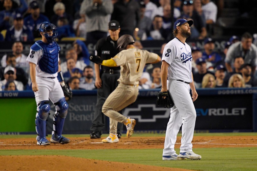 Clayton Kershaw of the Los Angeles Dodgers reacts after Ha-Seong Kim of the San Diego Padres scores on an RBI double by Manny Machado in the third inning in Game 2 of the National League Division Series at Dodger Stadium on Oct. 12, 2022, in Los Angeles, California. (Kevork Djansezian/Getty Images)