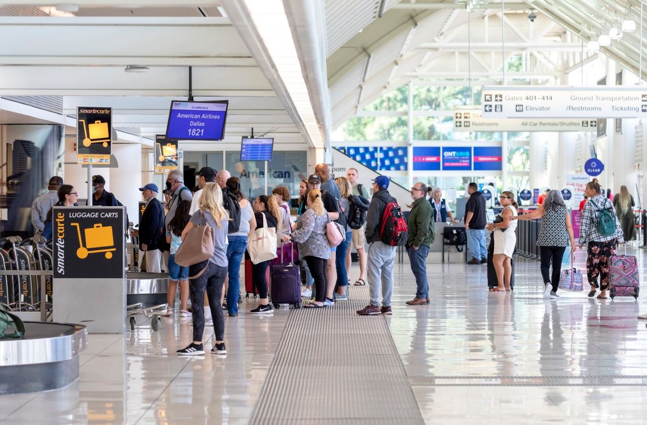 Passengers waiting at ticket gates inside the Ontario International Airport