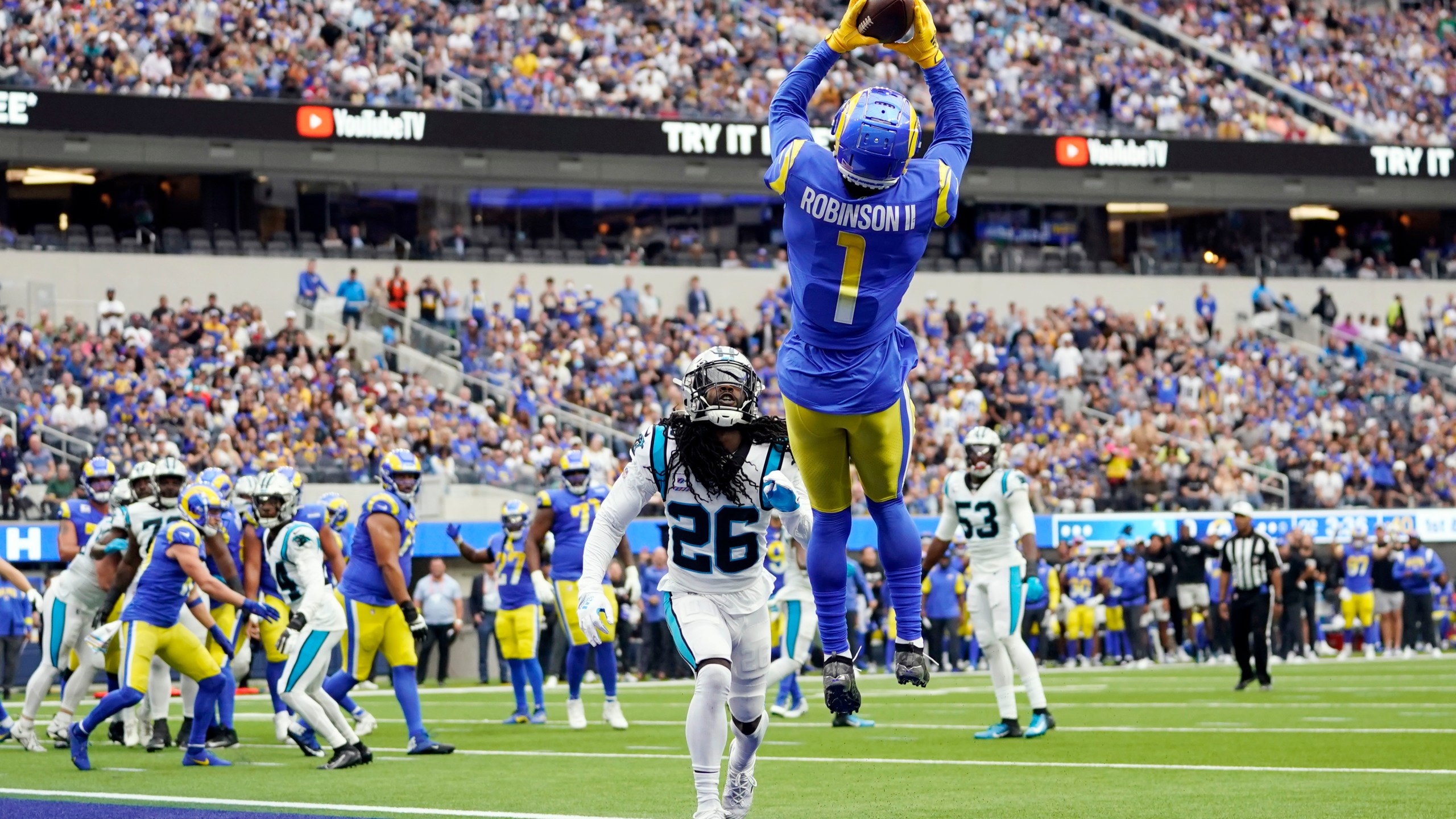 Los Angeles Rams wide receiver Allen Robinson II makes a touchdown catch over Carolina Panthers cornerback Donte Jackson during the first half of an NFL football game Sunday, Oct. 16, 2022, in Inglewood. (AP Photo/Ashley Landis)