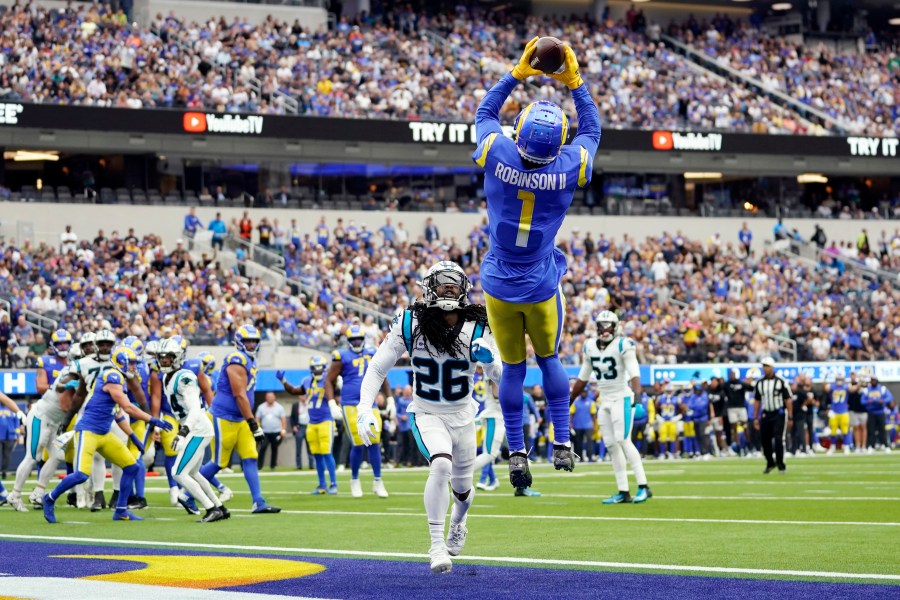 Los Angeles Rams wide receiver Allen Robinson II makes a touchdown catch over Carolina Panthers cornerback Donte Jackson during the first half of an NFL football game Sunday, Oct. 16, 2022, in Inglewood. (AP Photo/Ashley Landis)