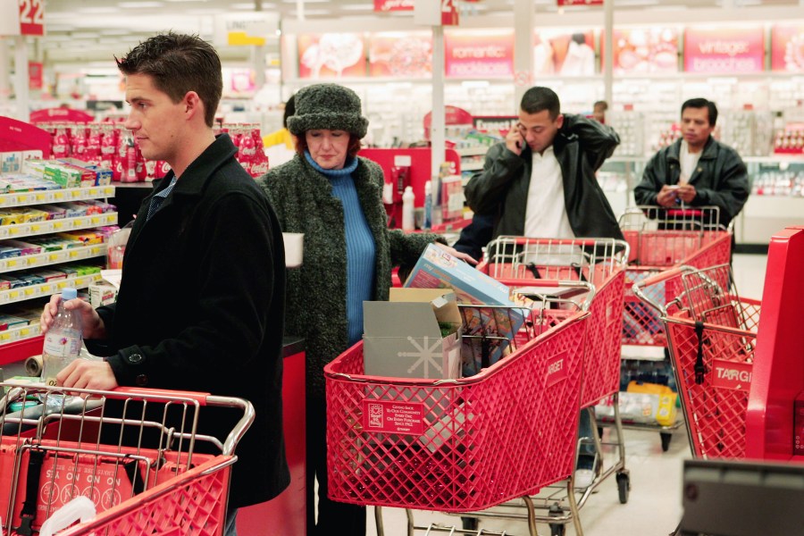 Shoppers line up to pay for their merchandise at a checkout counter in a Target store November 30, 2004 in Chicago, Illinois. (Scott Olson/Getty Images)